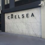 Channel letters "the Chelsea" on wall outside hotel